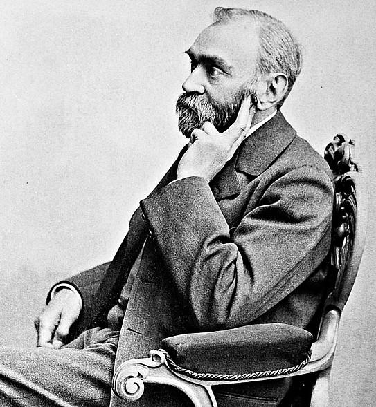 Historic black-and-white Photo of chemist Alfred Nobel sitting in a chair