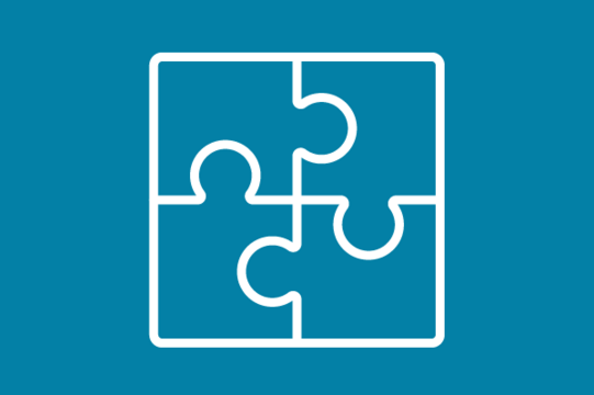 White icon on blue background: Four-piece puzzle