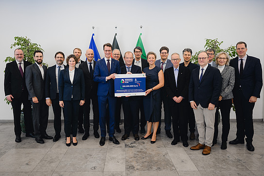 Group photo with grant notification