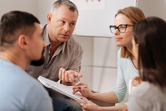 Group of people sitting together in a meeting situation