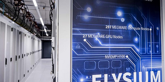 Photo: A blue poster with the word “Elysium” written on it hangs on a wall in a white room.