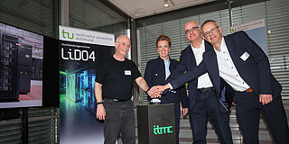 Photo: Several people ceremonially inaugurate the LiDO4 high-performance computer at TU Dortmund University.