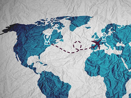 World map in the style of a print on crumpled fabric with a flight route from New York to the Ruhr area marked on it