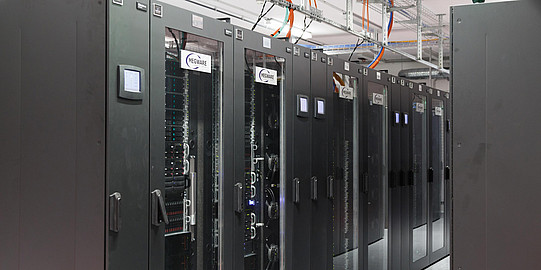 Photo: A room full of large, gray servers.