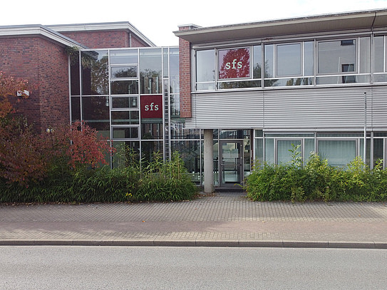 Two-story office building with glass/brick facade