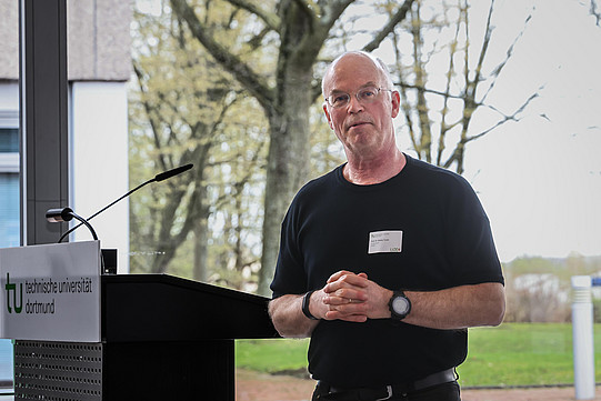 Photo: A person speaks at a podium.