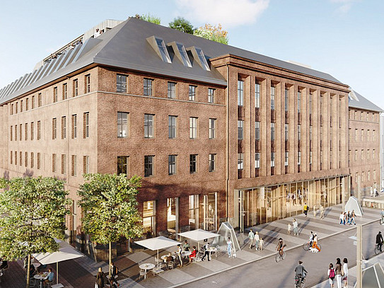 Exterior view of a large, renovated older building, with people in the foreground