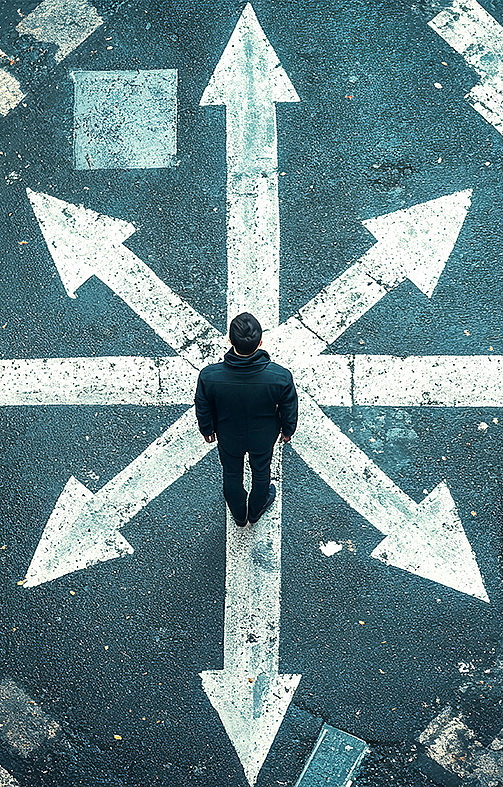 In the photo, you can see a person standing on arrows pointing in different directions.